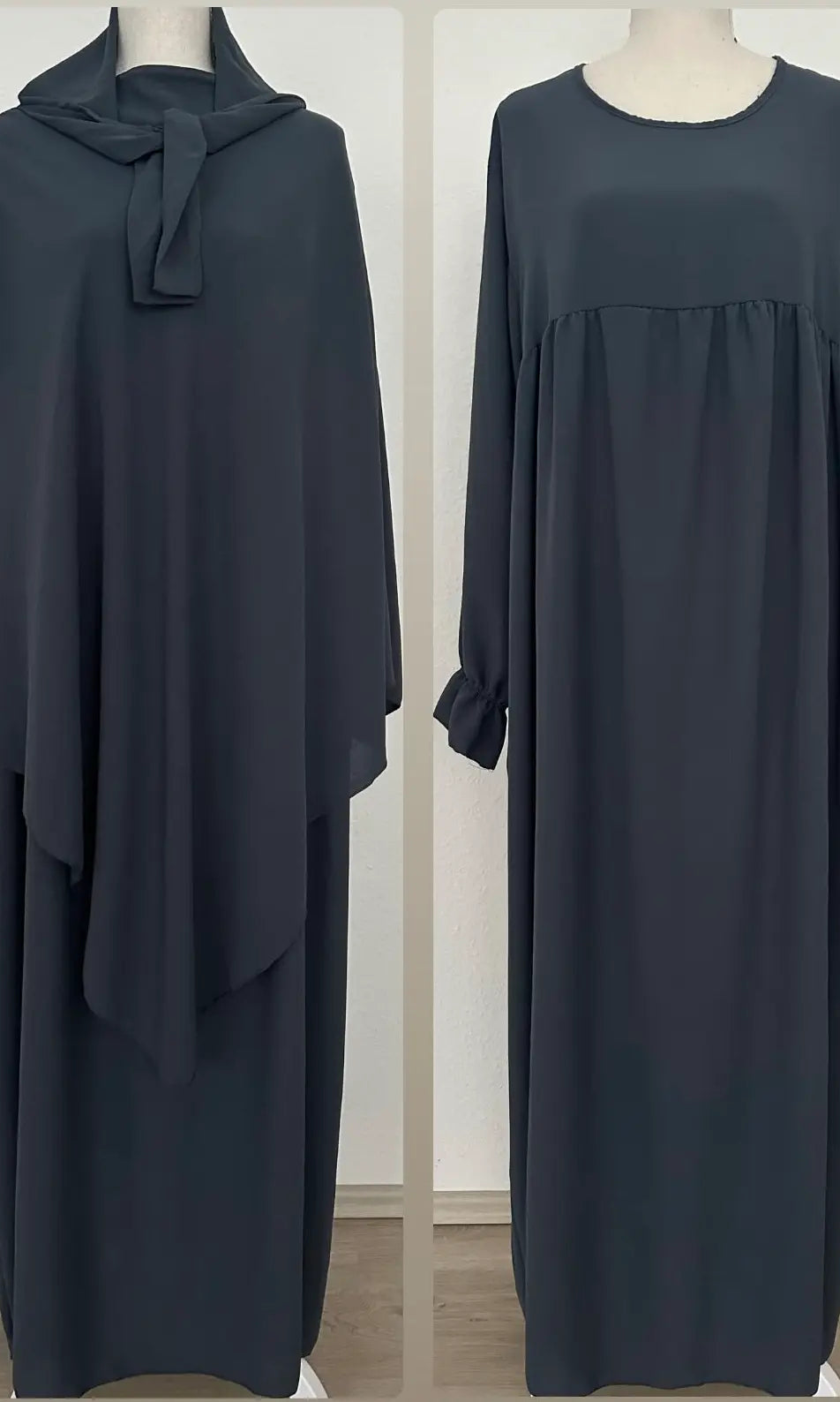 Abaya und Khimar in anthrazit; Khimar lang, gebunden vorn, Abaya mit geraffter Brust und Rüschenärmeln, Frontansicht.